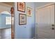 Inviting entryway with beautiful artwork and view to another room at 6961 Ray Charles Ln, Las Vegas, NV 89119