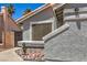 Exterior of the house featuring a private side gate at 6961 Ray Charles Ln, Las Vegas, NV 89119