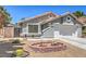 Well-maintained front yard with desert landscaping and charming exterior details at 6961 Ray Charles Ln, Las Vegas, NV 89119