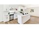 Bright kitchen showcasing a modern island and stainless steel appliances at 811 Spyglass Ln, Las Vegas, NV 89107