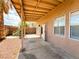 The covered patio leads to desert landscaping in this backyard at 8125 Rio De Janeiro Dr, Las Vegas, NV 89128