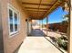 A covered patio offers shade in the backyard of this home at 8125 Rio De Janeiro Dr, Las Vegas, NV 89128