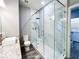 Modern bathroom featuring a glass-enclosed shower, marble accents, and granite counters at 8125 Rio De Janeiro Dr, Las Vegas, NV 89128