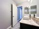 The bathroom features a modern sink with granite countertop and wood-look flooring at 8125 Rio De Janeiro Dr, Las Vegas, NV 89128