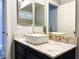 Bathroom vanity boasts granite countertops, vessel sink and gold-trimmed mirror at 8125 Rio De Janeiro Dr, Las Vegas, NV 89128