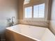 Close up of modern soaking tub and window in bathroom at 8125 Rio De Janeiro Dr, Las Vegas, NV 89128
