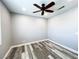Bedroom featuring modern fan, a closet, and attractive plank flooring at 8125 Rio De Janeiro Dr, Las Vegas, NV 89128