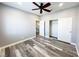Bedroom featuring wood-look floors, gray walls, ceiling fan, and closet at 8125 Rio De Janeiro Dr, Las Vegas, NV 89128
