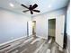 Bedroom featuring modern fan, a closet, and attractive plank flooring at 8125 Rio De Janeiro Dr, Las Vegas, NV 89128