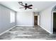Bedroom featuring gray hardwood floors and an open doorway to the hallway at 8125 Rio De Janeiro Dr, Las Vegas, NV 89128