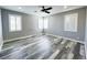 This bedroom features wood-look flooring and natural light at 8125 Rio De Janeiro Dr, Las Vegas, NV 89128