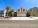 Charming two-story home featuring a neutral color scheme and a spacious two-car garage, ideal for families at 8125 Rio De Janeiro Dr, Las Vegas, NV 89128