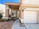 Inviting home entrance with a covered porch, a well-maintained lawn, and a single-car garage for convenience at 8125 Rio De Janeiro Dr, Las Vegas, NV 89128