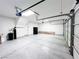 Large two car garage with speckled epoxy flooring, perfect for storage at 8125 Rio De Janeiro Dr, Las Vegas, NV 89128