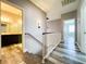 Upstairs hallway featuring wood-look floors connecting to bedrooms and bathrooms at 8125 Rio De Janeiro Dr, Las Vegas, NV 89128