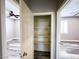 Hallway featuring a linen closet with a view to two bedrooms at 8125 Rio De Janeiro Dr, Las Vegas, NV 89128