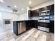 Kitchen features stainless appliances and open to the living room at 8125 Rio De Janeiro Dr, Las Vegas, NV 89128