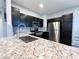 Modern kitchen with granite counters and stainless appliances at 8125 Rio De Janeiro Dr, Las Vegas, NV 89128