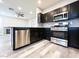 Kitchen features stainless steel appliances and open to the living room at 8125 Rio De Janeiro Dr, Las Vegas, NV 89128