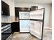 Spacious refrigerator with open doors in a kitchen with stainless appliances at 8125 Rio De Janeiro Dr, Las Vegas, NV 89128
