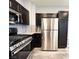 Features stainless steel appliances and dark cabinetry at 8125 Rio De Janeiro Dr, Las Vegas, NV 89128