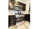 Stainless steel gas range and microwave featured in this updated kitchen at 8125 Rio De Janeiro Dr, Las Vegas, NV 89128