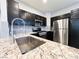 Modern kitchen features granite counters and stainless appliances at 8125 Rio De Janeiro Dr, Las Vegas, NV 89128
