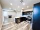 Updated kitchen featuring stainless appliances, black cabinetry, and granite countertops at 8125 Rio De Janeiro Dr, Las Vegas, NV 89128
