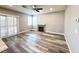 Hardwood flooring in living room with fireplace and sliding door access to the backyard at 8125 Rio De Janeiro Dr, Las Vegas, NV 89128