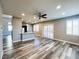 Hardwood flooring in open concept living and kitchen area, showcasing bright natural light at 8125 Rio De Janeiro Dr, Las Vegas, NV 89128
