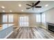 Cozy living room with fireplace, hardwood floors, and sliding door access to the backyard at 8125 Rio De Janeiro Dr, Las Vegas, NV 89128