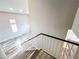 The staircase features wood-look flooring with a view to the living area at 8125 Rio De Janeiro Dr, Las Vegas, NV 89128