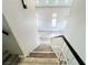 The staircase features wood-look flooring that continues throughout the house at 8125 Rio De Janeiro Dr, Las Vegas, NV 89128