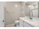 Bright bathroom with single vanity, framed mirror, and tiled flooring at 8490 Classique Ave # 101, Las Vegas, NV 89178