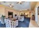 Resident lounge with cozy seating around a fireplace and TV at 8490 Classique Ave # 101, Las Vegas, NV 89178