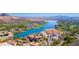 Breathtaking aerial view showcasing a vibrant lakeside community with stunning mountain vistas at 89 Via Franello, Henderson, NV 89011