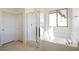 Modern bathroom with large tub, shower, and natural light at 89 Via Franello, Henderson, NV 89011