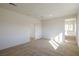 Bedroom with carpet flooring leading to adjoining bathroom and walk-in closet at 89 Via Franello, Henderson, NV 89011