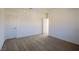 Large carpeted bedroom with neutral walls and multiple doors at 89 Via Franello, Henderson, NV 89011