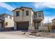 Contemporary two-story home featuring a tile roof, two car garage and neutral stucco at 89 Via Franello, Henderson, NV 89011