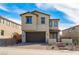 Charming two-story home featuring desert landscaping, a two-car garage, and a welcoming front porch at 89 Via Franello, Henderson, NV 89011