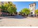 Charming street view with cafes and restaurants surrounded by lush greenery and beautiful architecture at 89 Via Franello, Henderson, NV 89011