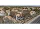 A high-angle aerial view shows mature trees and landscaping around the house at 92 Sea Holly Way, Henderson, NV 89074