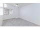 Bright bedroom featuring a window, carpet flooring and ceiling fan at 92 Sea Holly Way, Henderson, NV 89074