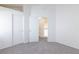Bedroom features neutral carpet and closet with sliding doors at 92 Sea Holly Way, Henderson, NV 89074