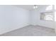 Bright bedroom featuring a window, carpet flooring and ceiling fan at 92 Sea Holly Way, Henderson, NV 89074
