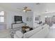 Cozy living room with modern decor, open layout and adjacent eat-in kitchen at 92 Sea Holly Way, Henderson, NV 89074