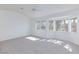 The main bedroom features neutral carpet and multiple windows that provide natural light at 92 Sea Holly Way, Henderson, NV 89074