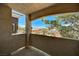 Balcony view from condo complex offering a serene view of a neighborhood street on a bright sunny day at 9303 Gilcrease Ave # 2217, Las Vegas, NV 89149