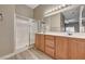 Bright bathroom featuring a double vanity sink, walk-in shower, and neutral decor at 9303 Gilcrease Ave # 2217, Las Vegas, NV 89149